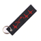 porte-clé moto biker en tissu noir avec broderie rouge en forme de battement de cœur et silhouette de moto