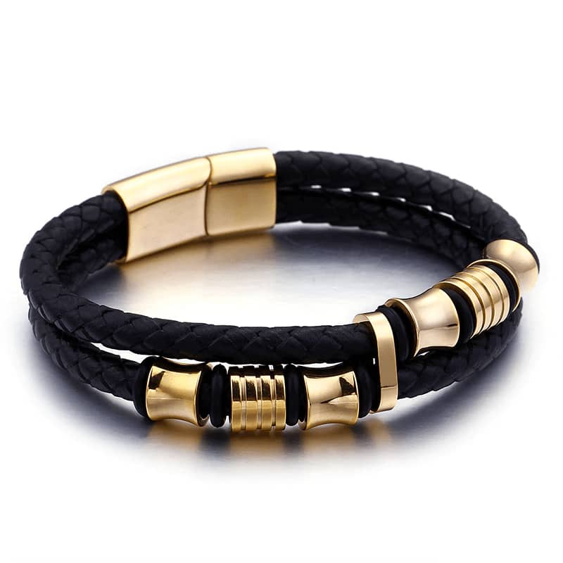 Bracelet biker en cuir tressé noir et acier doré pour femme