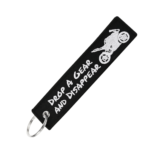 porte-clé moto en tissu noir avec broderie "Drop a gear and disappear"