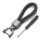 Porte-clé moto en cuir tressé noir avec boucle en acier inoxydable, style biker robuste et élégant.